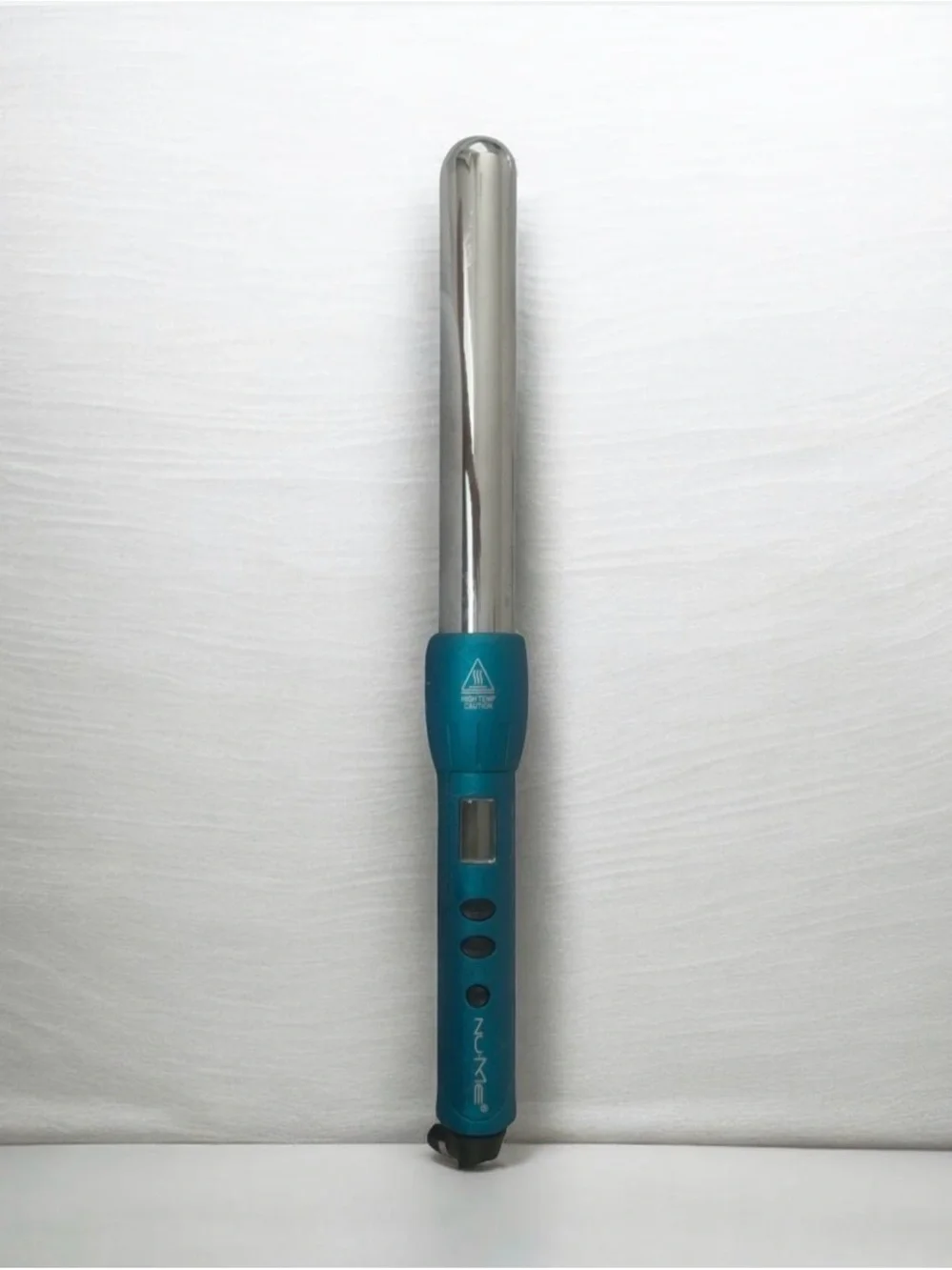Authentic NuMe digital curling wand in teal.